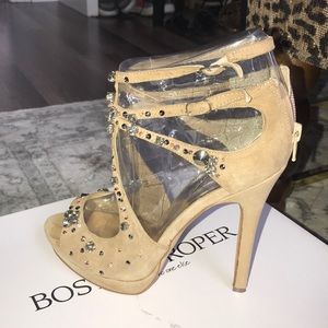 Tan suede embellished open toe ankle sandals.